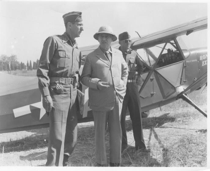 <p class='eng'>Lt. Gen. Mark Clark with Sec. of War Stimpson with Lt. Col. John T. Walker next to his Aircraft, the Rome Express, Italy 1944.</p>